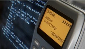 Telefone Orbitel antigo da Vodafone, com a mensagem "Merry Christmas", o primeiro SMS que vai virar NFT