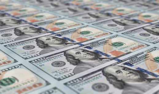 Várias notas de 100 dólares grudadas, alusivo ao fluxo cambial